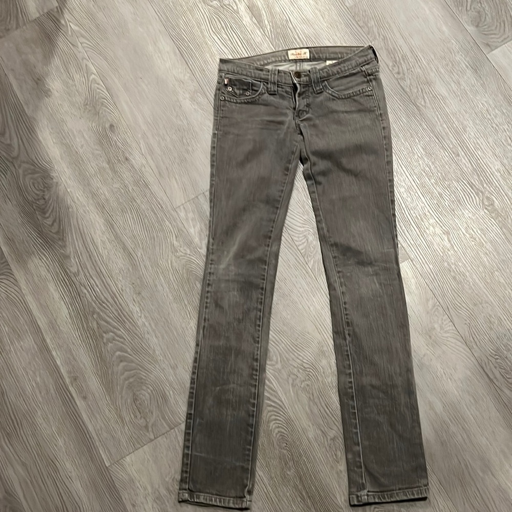 Frankie B woman’s jeans. Super low rise boot cut in washed steel grey .